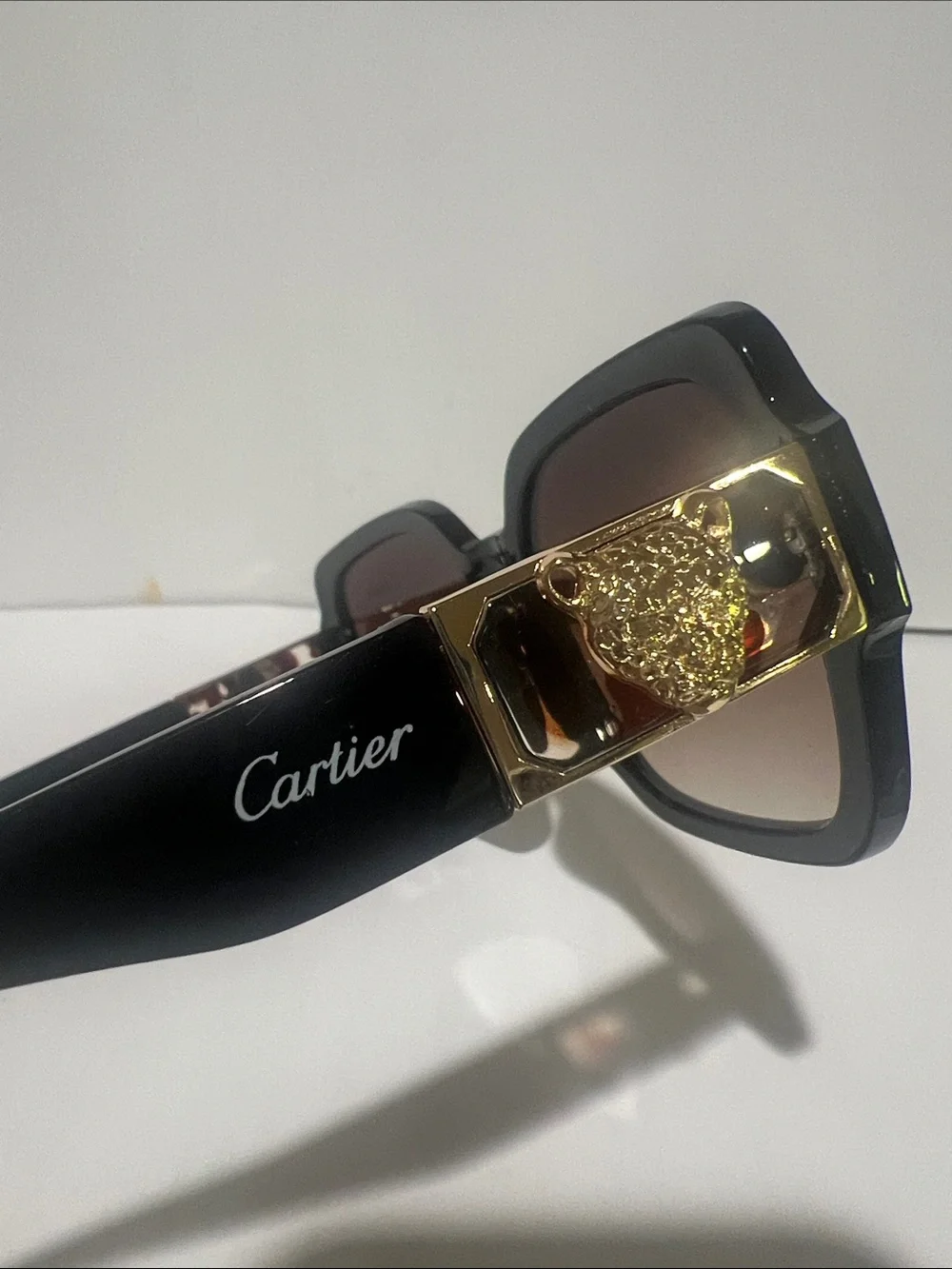 Cartier Women's Black Frame Sunglasses with Brown Gradient Lenses